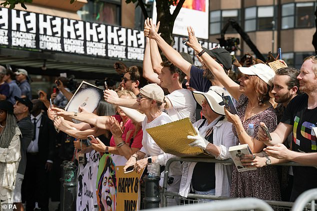 Excited: People lined the street to catch a glimpse of the rock and roll legends