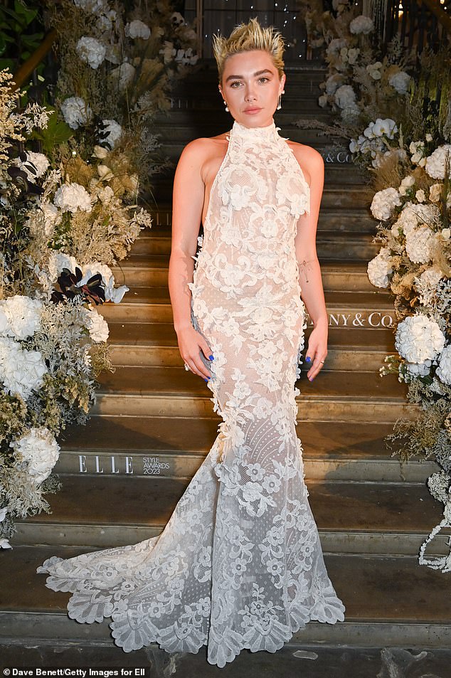 Stunning: The fishtail dress was tailored to perfection and fit like a glove, and she added a splash of color to the ensemble with a bright blue manicure