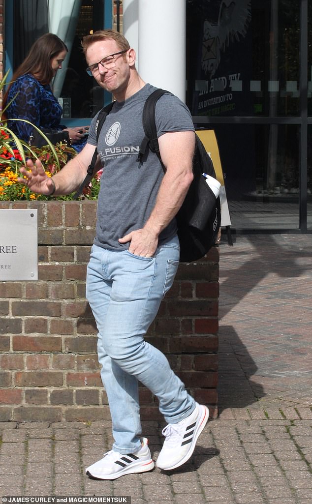 Excited: Jody Cundy, English cyclist, 44, appeared happy and relaxed as he waved at the photos