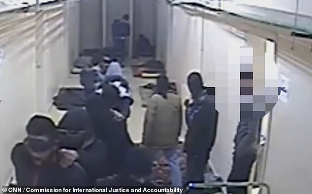 Other prisoners, their heads covered with bags, were seen marching in a long line through the gloomy corridors of the hospital that was now ISIS headquarters.