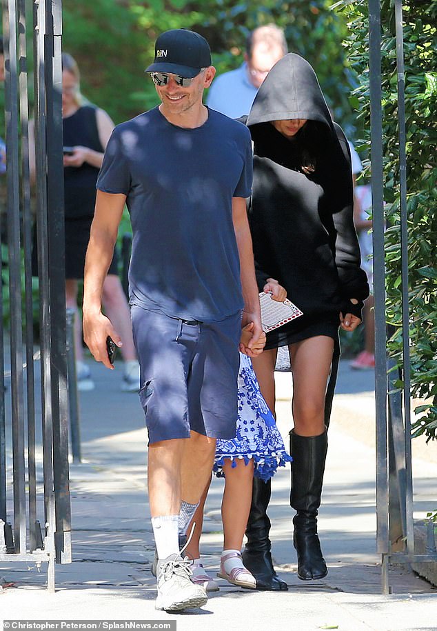 Doting parents: The supermodel kept her head down as she and her top list ex held hands with little Lea on her way to her first day of school