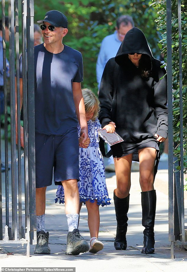 Like mother, like daughter: Lea kept her head down on her way to school, just like her famous supermodel mom, as Bradley smiled