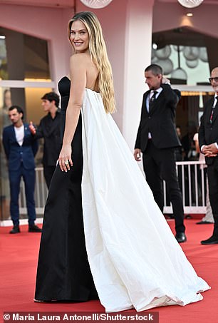 Here she comes: Bar Refaeli arrived early Wednesday and claimed her share of the spotlight in a flowy silk evening gown ahead of Origin's first official screening