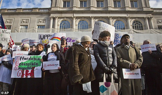 Airbnb tried to challenge the new regulations in a lawsuit, but the case was dismissed.  Pictured: An Airbnb gathering outside New York City Hall in 2015