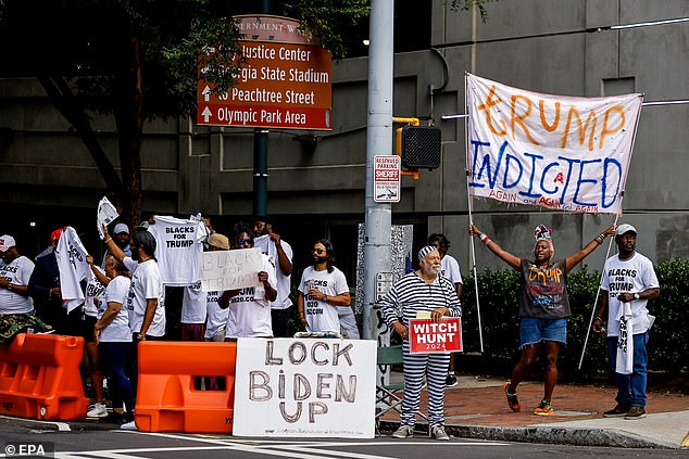 Blacks for Trump gathered outside the courthouse on Wednesday before the hearing.  A small number of Trump opponents also showed up and made themselves heard