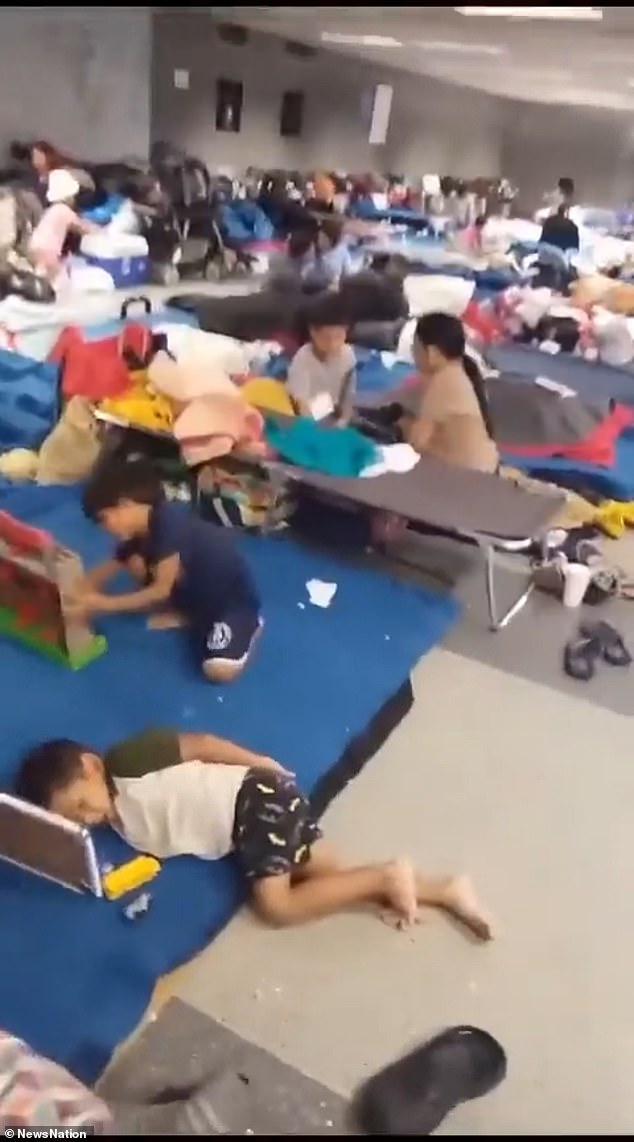 The video from the shelter shows children sprawled across the room and shows the harsh living conditions, with some migrants describing the situation as truly inhumane.