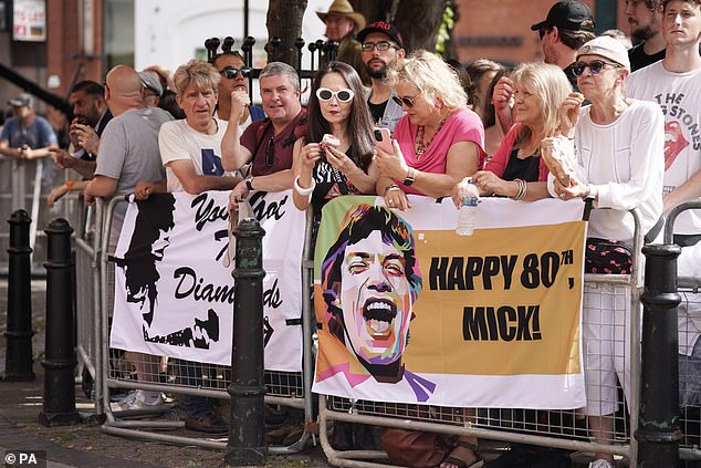 Fans wish Sir Mick Jagger a happy 80th birthday outside the London event