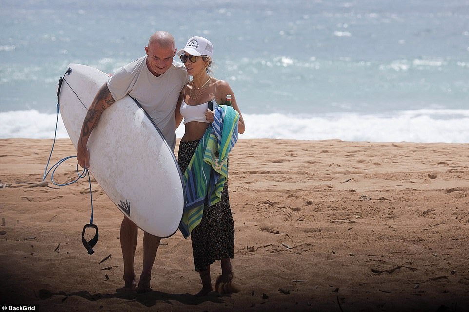 So happy together: 56-year-old Tish looked slim in a white bra top that showed off her many tattoos while they were snorkeling.