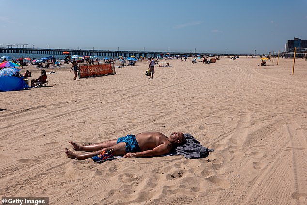 Beach residents of Coney Island take advantage of the less crowded beach than usual