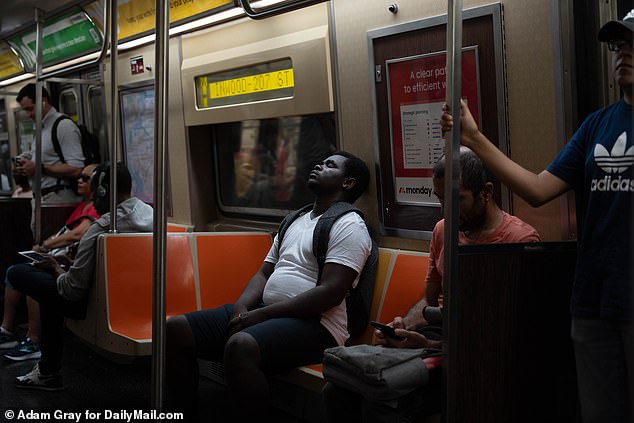 Commuters take a rest in subways while temporarily resting from the intense heat that plagues most subway stations