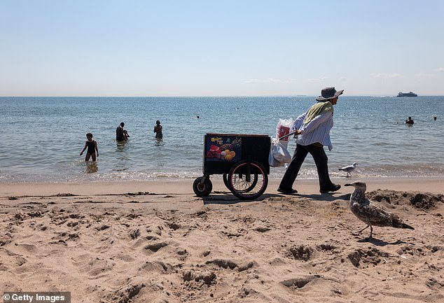 Summer's last spots include ice cream peddlers roaming the beach selling their wares to the burning beach residents