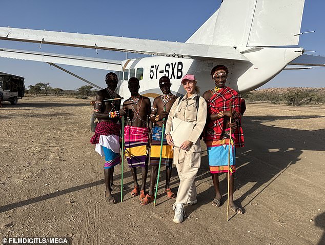 Ready to take off: The reality star posed by a small plane during her travels