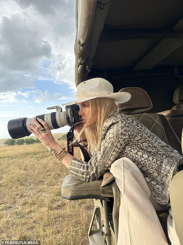 Natural: She looked like a natural behind the camera as she photographed the wildlife