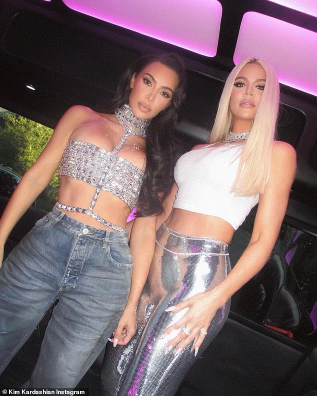 Sister power: She shared a number of photos to her Instagram, including one of her and sister Khloe Kardashian, 39, rocking a pair of form-fitting silver pants for the occasion