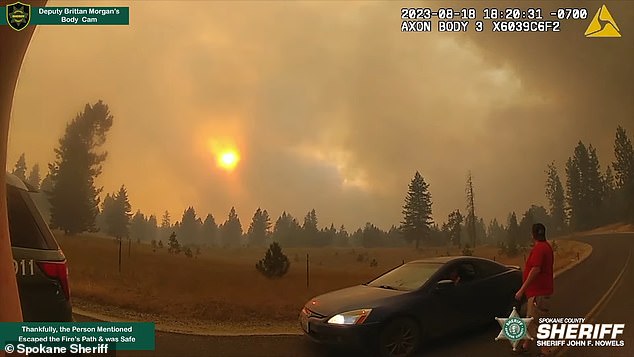 The sun is almost completely blocked by smoke caused by the fire