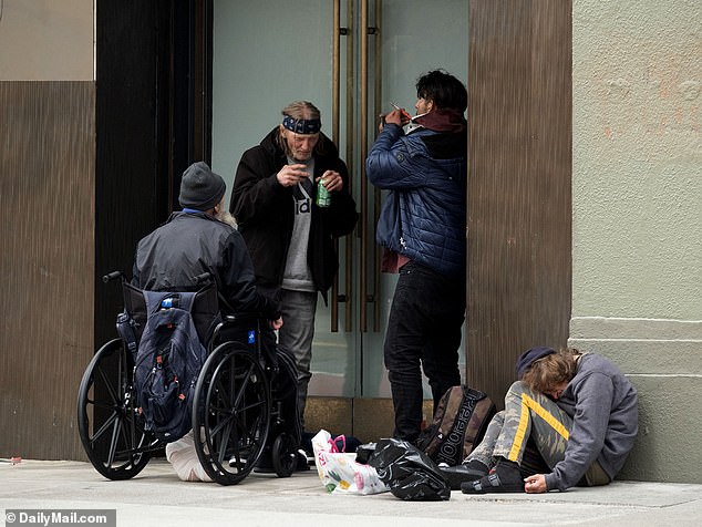 Groups of people use drugs on the streets of San Francisco