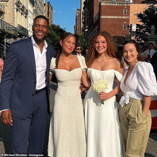 Michael's 18-year-old twin daughters Sophia and Isabella are both high school graduates and attend prestigious universities;  as the trio are seen from left to right with Michael's girlfriend Kayla Quick at their high school graduation