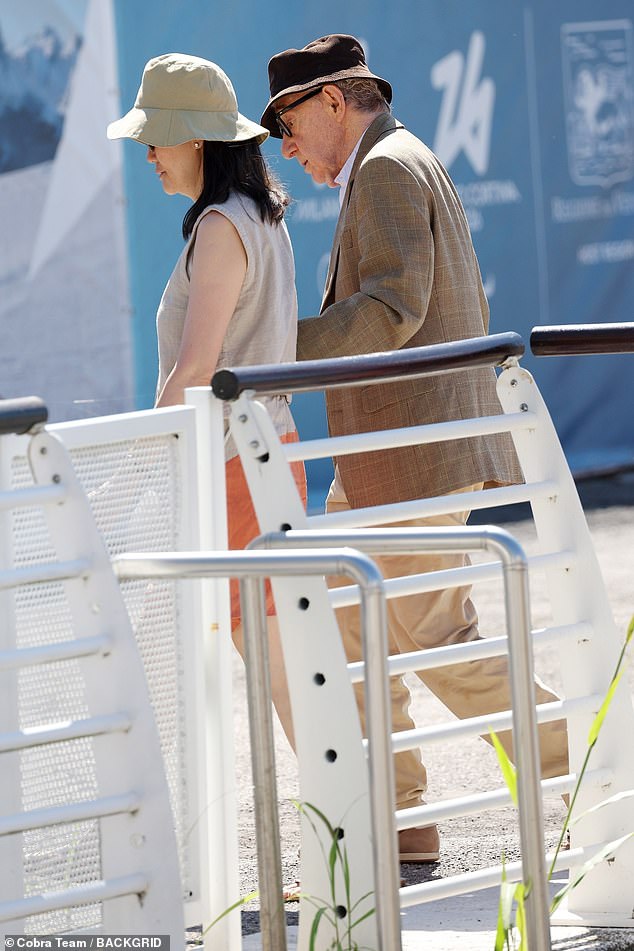 Couple: The filmmaker, 87, walked along the dock to their waiting water taxi with help from his wife Soon-Yi Previn, 52