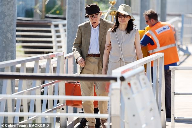 Brave: Woody looked smart in a white shirt and beige belted chinos, under a plaid blazer, while hiding under a brown hat