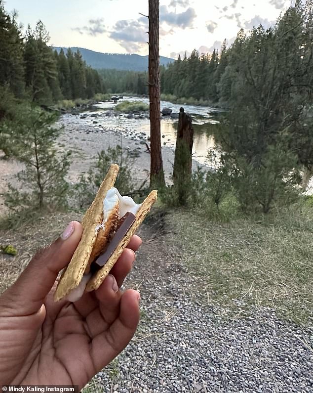 Sweet treat: Kaling held up one of her many s'mores creations during the trip