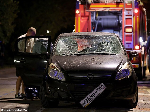 After the strike, a damaged car is seen