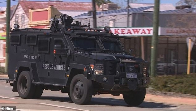 All facilities and public events in the Shire of Merredin, which includes Kellerberrin, have been canceled until further notice.  Armored police cars patrol the tense scene