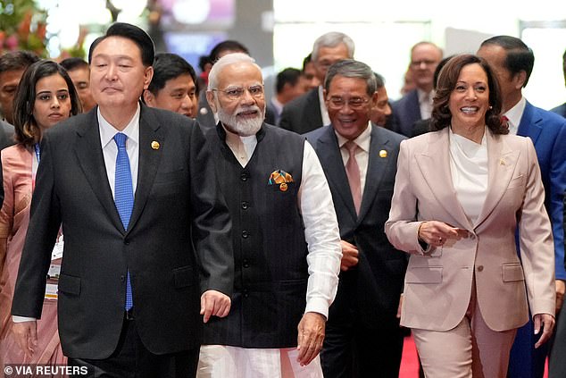 From left to right, South Korean President Yoon Suk Yeol, Indian Prime Minister Narendra Modi, Chinese Premier Li Qiang and US Vice President Kamala Harris walk to the Association of Southeast Asian Nations (ASEAN) Summit in Jakarta.  , Indonesia, Thursday, September 7, 2023. Biden meets Modi Friday as his first event at the G20 summit