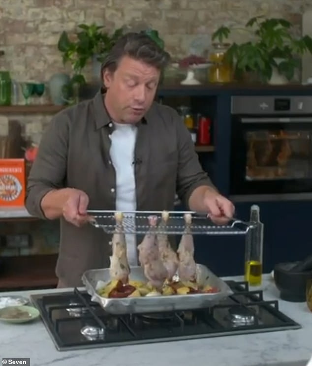 Jamie then placed the rack in a hot oven so that the chicken pieces hung over the vegetables, allowing the excess marinade to drip into the baking tray for added flavor.