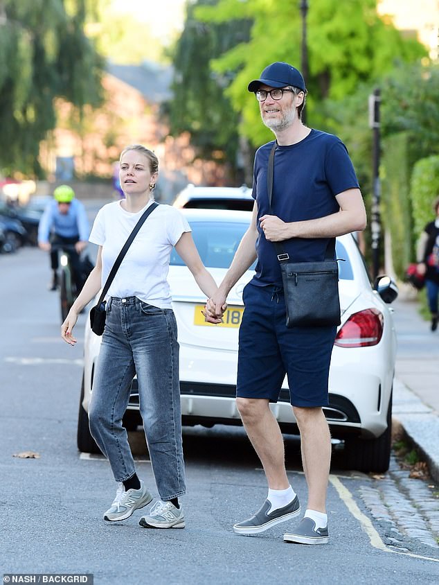 Out and about: The pair were pictured walking through Primrose Hill as they made the most of Britain's heat wave