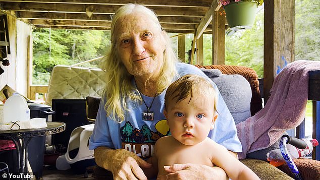 Baby Braxton is bounced on the knee of his great-grandmother, Betty