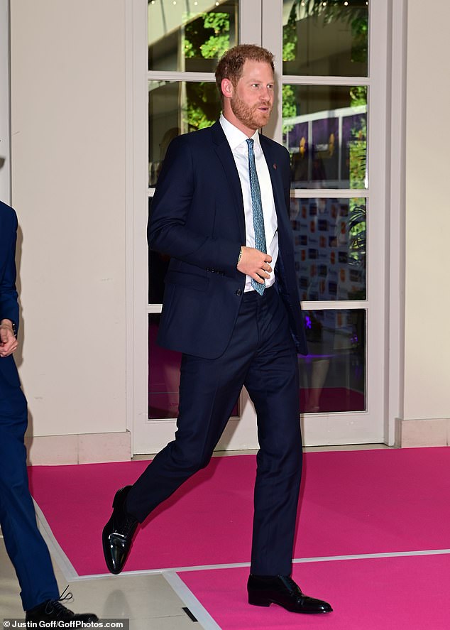 The duke appeared in good spirits on his arrival in Britain