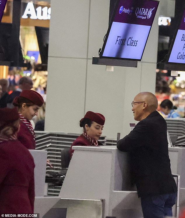 The high-profile surgeon dressed casually for the 15-hour flight in jeans, a t-shirt, a black blazer and a pair of comfy sneakers (pictured)