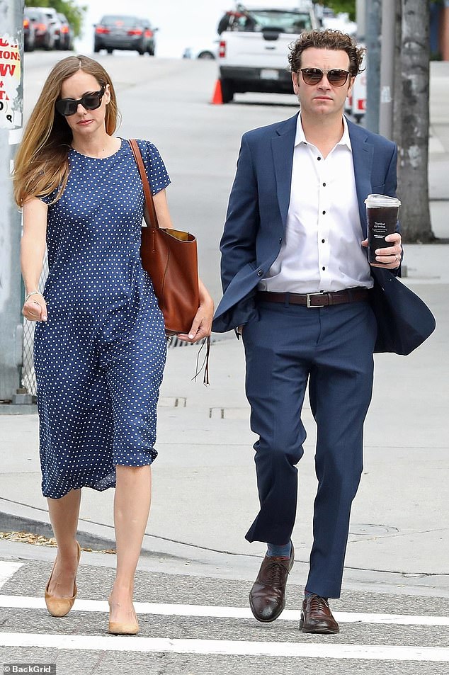 A judge ordered that he be taken into custody and scheduled a hearing for August 4.  Bijou wore a dark blue dress with white polka dots when she arrived at court with her husband.