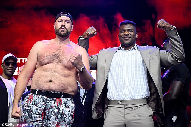 Fury will take on mixed martial arts star Francis Ngannou (R) in a boxing bout on October 28