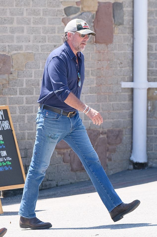 The president's scandal-stricken son donned his signature aviator glasses and cap after spending an hour at a luxury restaurant on the pier on Thursday afternoon