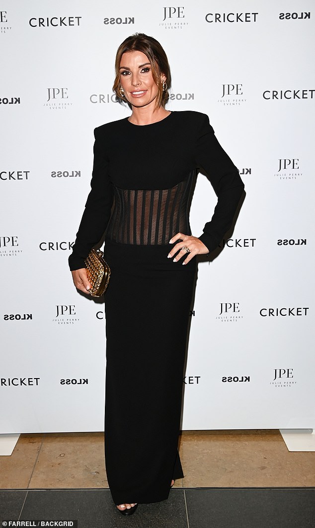 Gorgeous: The WAG looked sensational in a gorgeous black dress with sheer panels at her slim waist