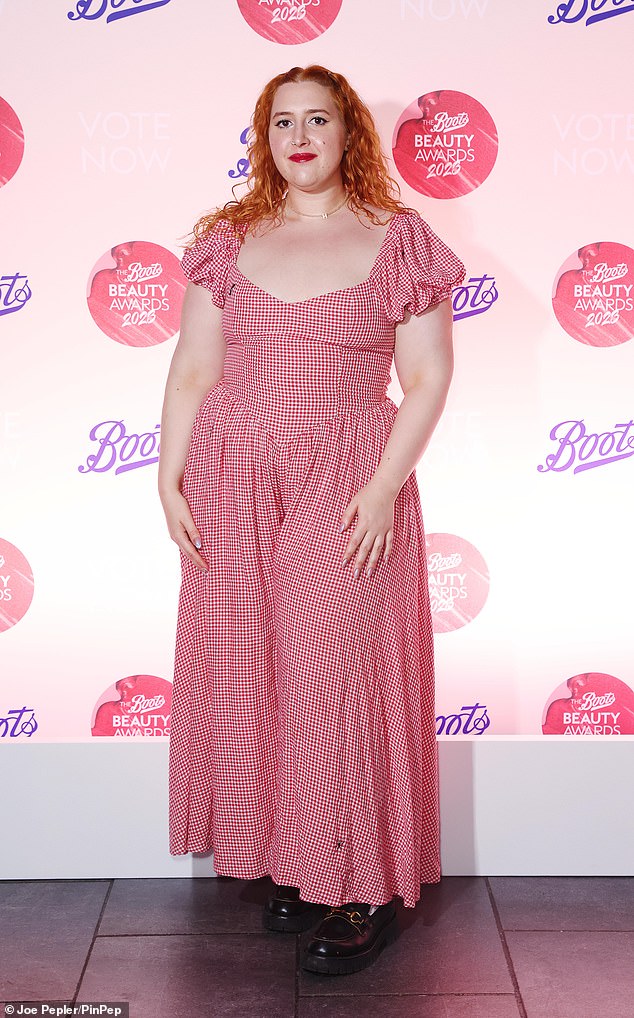 Trendy: Jonathan Ross's daughter, Honey, looks classy in a short-sleeved red gingham dress with a low-cut neckline