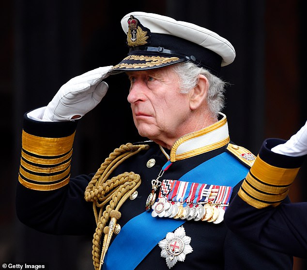 King Charles salutes the coffin of his mother Queen Elizabeth as he attends the Committal Service for Queen Elizabeth at St George's Chapel, Windsor