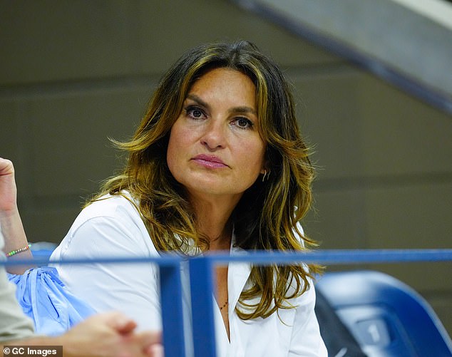 Sharp: Before the match, Hargitay looked sharp in a white long-sleeved button-up shirt and a yellow crossbody bag