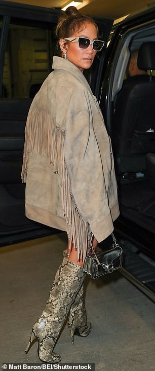 Sexy in suede: She wore an oversized suede jacket with fringes