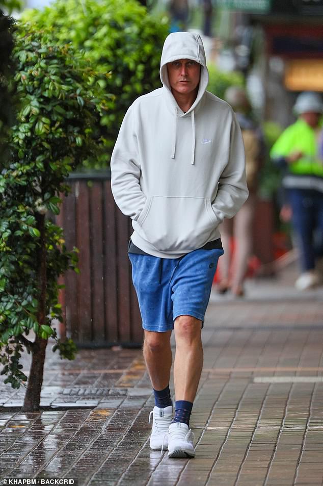 The former professional sprinter, 44, appeared to be trying the 'eshay' look as he donned baggy blue Nike shorts and an oversized gray Nike hoodie