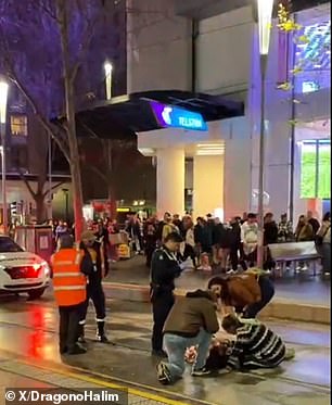 Pedestrians crawled over a person on the ground