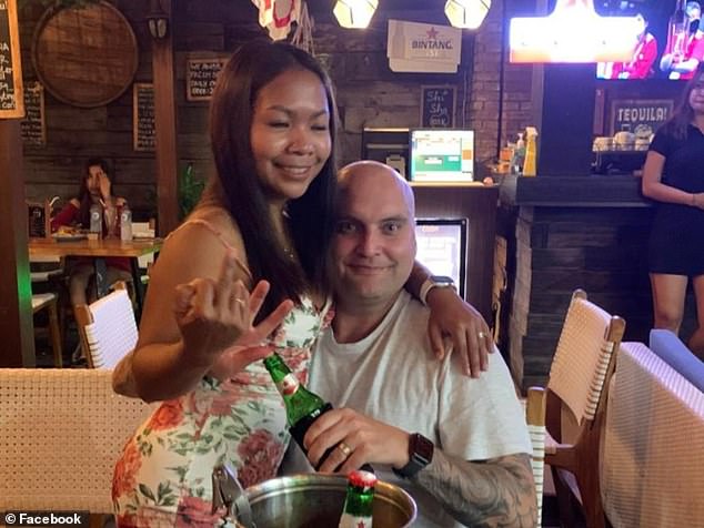 Mr Johnston (pictured with his wife Ni Nyoman Purnianti) had been drinking with Wijaya Arak before reportedly getting drunk and urinating on the bar owner and cocktail expert