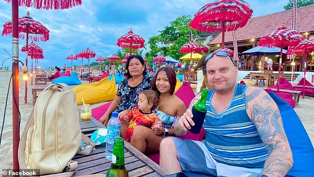 Mr Johnston was discovered by his wife (pictured together) in a pool of his own blood at Wijaya's Uncle Benz Cafe in Badung at 3:45am on February 23 after the bar owner fled the scene.