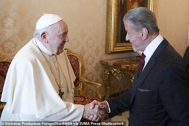 Stallone shakes hands with Pope Francis at the Apostolic Palace in Vatican City