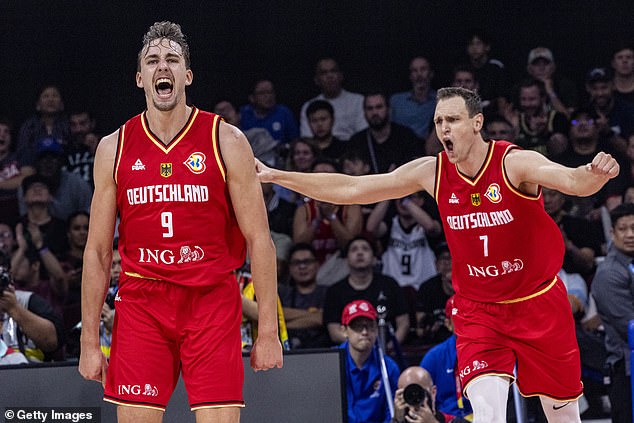 Franz Wagner (left) and Johannes Voigtmann from Germany celebrate after scoring against the USA