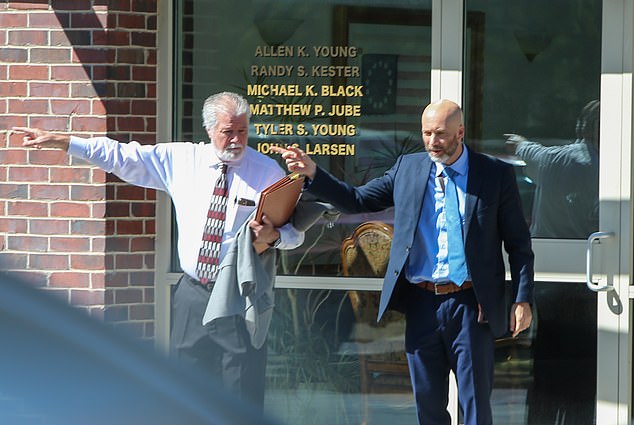 Husband Kevin is photographed outside Thursday's hearing with his attorney Randy Kester