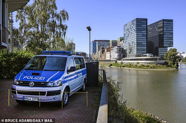 German police vehicles are parked near the Hyatt Regency hotel in Dusseldorf as security is stepped up ahead of Harry's arrival