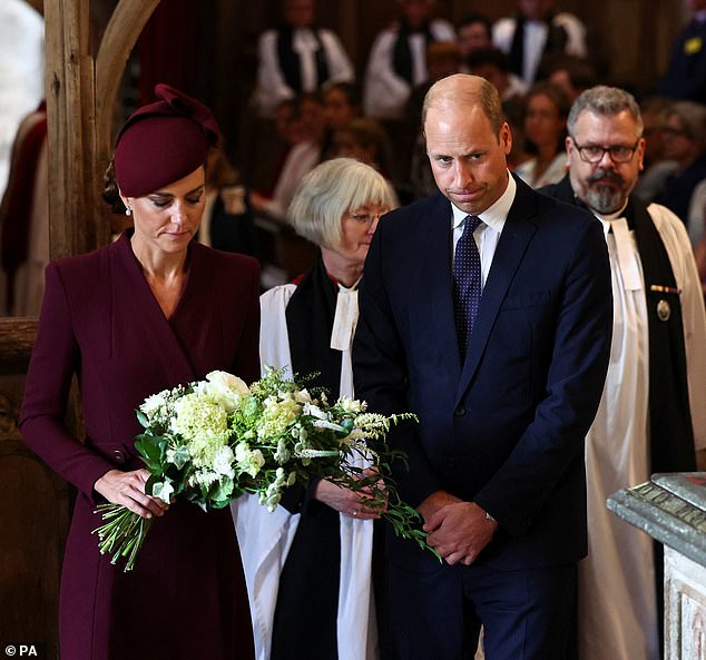 The Prince and Princess of Wales bow their heads as they attend a service at St David's Cathedral where prayers were said for the Queen