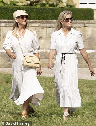 The Duchess looked relaxed on the emotional day, wearing a sophisticated pinstripe shirt dress with a flowing silhouette, perfect for today's warm weather